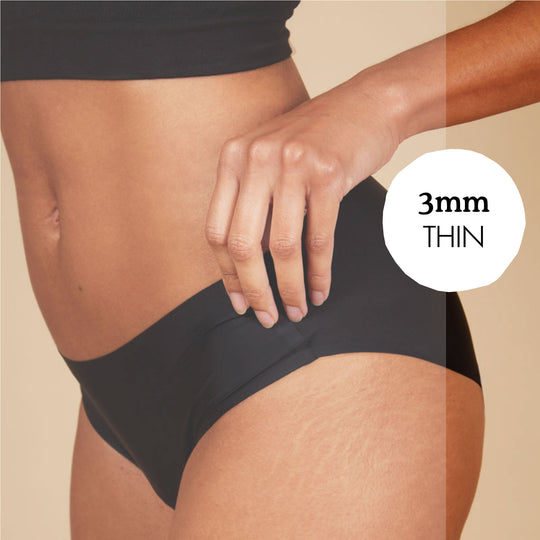 close up of woman wearing seamless period underwear with text bubble showing 3mm thin