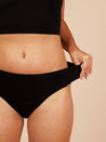 close up of woman wearing one size stretch period pants